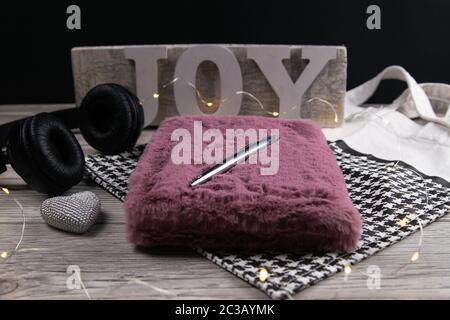 Leather handbag, clean blank notepad, pen, glasses, watch on a wooden background, top view. Free space for text. Workplace business background Stock Photo