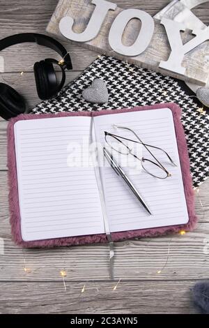 Leather handbag, clean blank notepad, pen, glasses, watch on a wooden background, top view. Free space for text. Workplace business background Stock Photo