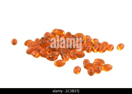 omega 3 pills heap isolated on a white background.pile of fish oil gel capsules. Cod liver oil  Supplement in soft gel form Stock Photo