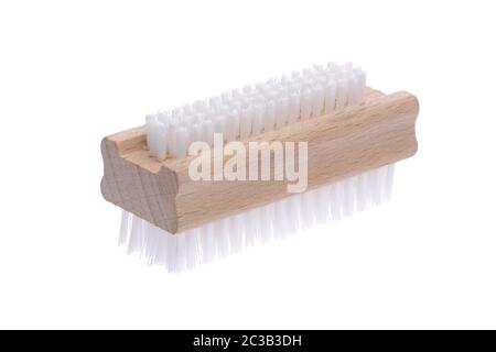 traditional wood nail brush with short bristles inclined on a white background Stock Photo