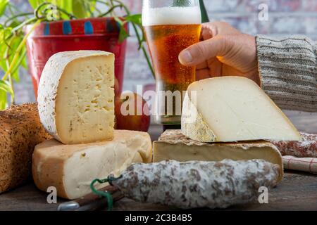 cheeses, sausage and Tomme de Savoie, Savoy, the french Alps France. Stock Photo