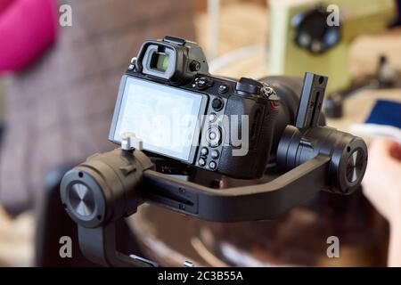 Mirrorless camera on gimbal stabilizer Stock Photo