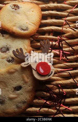 Christmas biscuits with reindeer on straw background Stock Photo