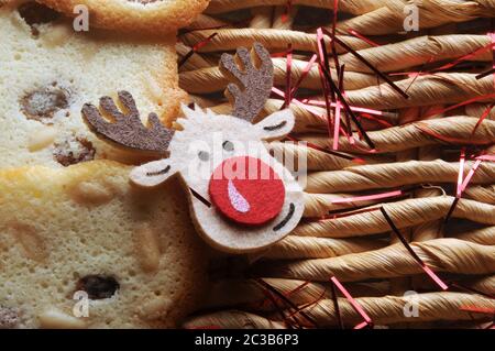 Christmas biscuits with reindeer on straw background Stock Photo