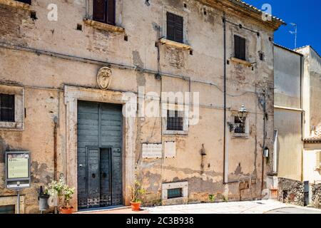 June 30, 2019 - Amelia, Umbria, Terni, Italy - Palazzo Petrignani, seat of the municipality of the city of Amelia, in Umbria. The old wooden door. Stock Photo