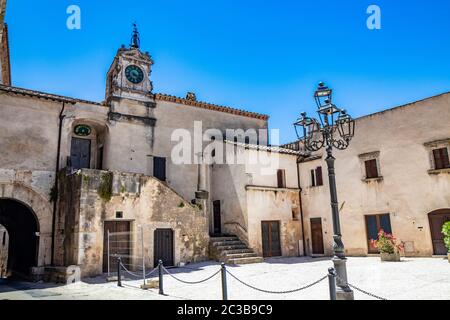 June 30, 2019 - Amelia, Umbria, Terni, Italy - Piazza Guglielmo Marconi in Amelia. An iron lamppost, the tower with the clock and the bell. The adjace Stock Photo