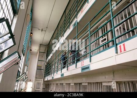 Rosharon Texas USA, August 26 2013: Prison guard walks his beat on elevated cellblock at Darrington prison, a maximum-security unit of the Texas Department of Criminal Justice system. ©Marjorie Kamys Cotera/Daemmrich Photography Stock Photo
