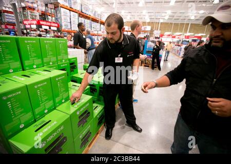 Cedar Park Texas USA, November 22 2013: Consumers take advantage of low prices for the popular XBox One gaming console, offered as a promotion to attract shoppers to opening day of a new Costco warehouse club in a fast-growing Austin suburb.   ©Marjorie Kamys Cotera/Daemmrich Photography Stock Photo