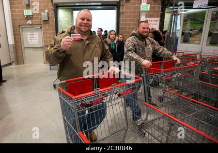 Cedar Park Texas USA, November 22 2013: Customer displays membership card upon entering newly opened Costco warehouse club in a fast-growing Austin suburb.   ©Marjorie Kamys Cotera/Daemmrich Photography Stock Photo
