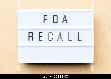 White lightbox with word fda recall on wood background Stock Photo