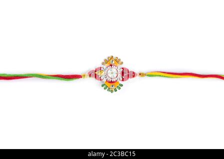 Indian festival: Raksha Bandhan background with an elegant Rakhi on a white background Stock Photo