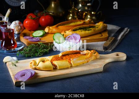 Pide with minced meat, spinach feta and sheep's cheese Stock Photo