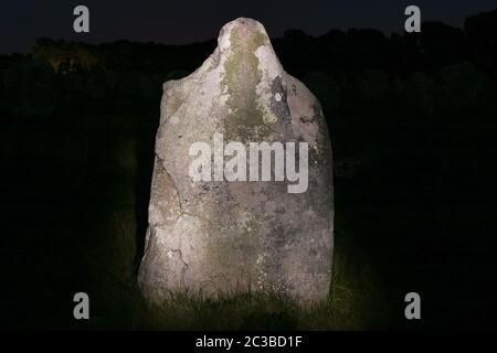 Menhir at night - Alignements du Menec  - rows of Menhirs - standing stones - the largest megalithic site in the world, Carnac, Brittany, France Stock Photo