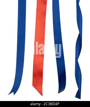 dark blue and red silk ribbons isolated on white background, decor hangs and twisted Stock Photo