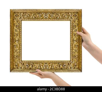 Wooden picture frame in hands Stock Photo