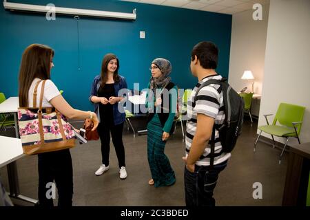 Austin, Texas USA, August 27, 2014: Multi-ethnic group of students chat in a student lounge area at the new Austin Community College campus built in a former shopping mall. ©Marjorie Kamys Cotera/Daemmrich Photography Stock Photo