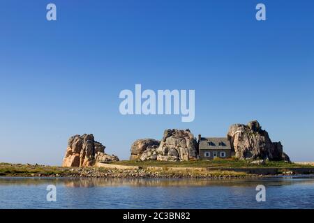 famous house on the rocks at ploumenach, cote de granit rose, cotes d'armor brittany, france Stock Photo