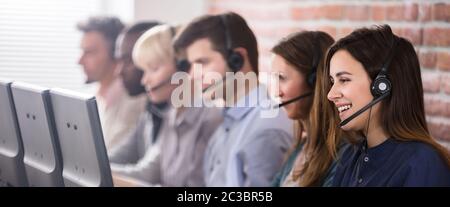 Female Customer Services Agent Working In A Call Center Stock Photo