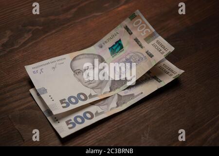 Two new five hundred hryvnia notes. New Ukrainian 500 hryvnias paper banknotes on table. Cash money concept. Deposit concept Stock Photo