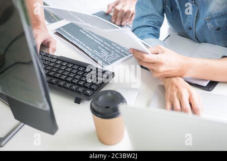 Asian team Outsource Developer Looking Screen Programming Code Working with Laptop Computer Software Stock Photo