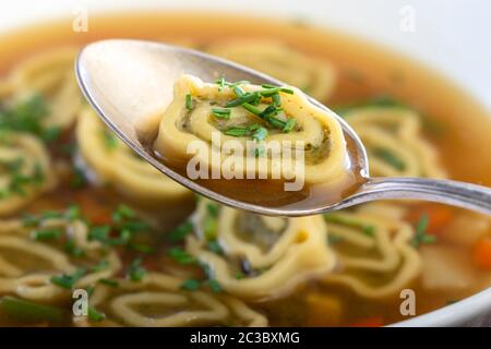 bavarian maultasche soup on wood Stock Photo