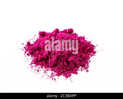 Dragon fruit powder heap isolated on white with clipping path. Perfect bright magenta freeze dried pitahaya cactus or Hylocereus costaricensis powder Stock Photo