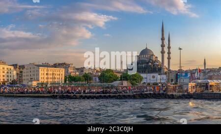 Istambul, Turkey – 07.12.2019. Panoramic view of Eminonu Square, Galata Bridge, Galata Tower and New Mosque in istanbul on a sunny summer evening Stock Photo