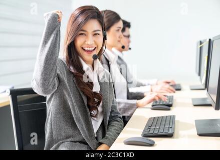 Smiling call Center working Stock Photo