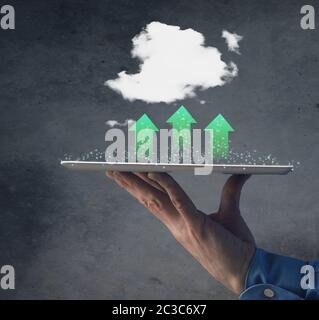 Businessman with a table and green cloud computing concept, data transfer, green storage concept, alternative energy Stock Photo