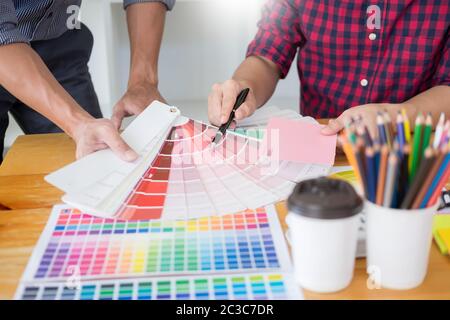 team Web designer working drawing something on graphic computer in the office or studio Stock Photo