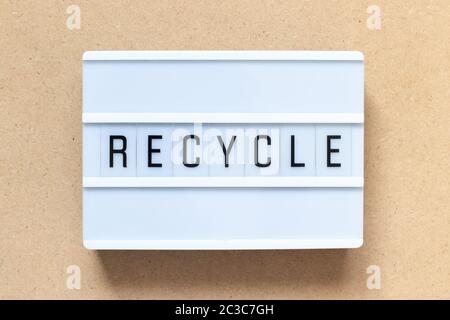 White lightbox with word recycle on wood background Stock Photo