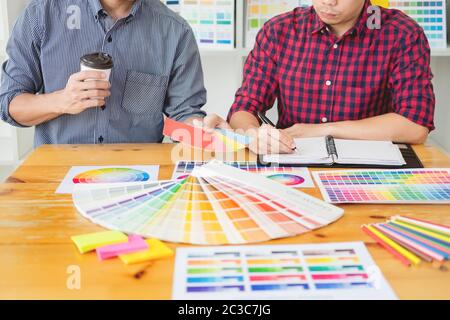 team Web designer working drawing something on graphic computer in the office or studio Stock Photo