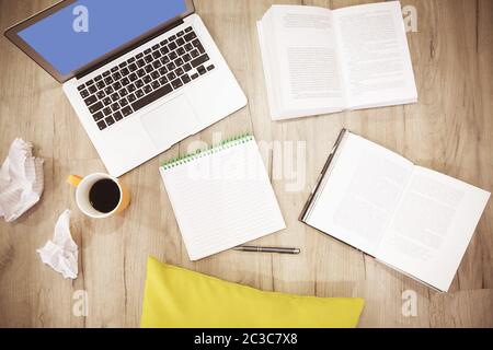 Laptop and books working at home Stock Photo