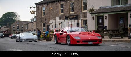 Supercars passing through the market town of Hawes in the Yorkshire Dales, UK, being filmed for the BBC Top Gear television program. UK Stock Photo