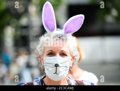 19 June 2020, Hessen, Frankfurt/Main: A teacher takes part in the rally dressed as a 'guinea pig' and wearing mouth and nose protection. The Union for Education and Science (GEW) is holding a rally against planned school openings in Hesse. The motto of the protest is 'We are not available as guinea pigs'. Photo: Andreas Arnold/dpa Stock Photo