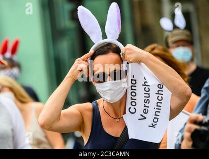 19 June 2020, Hessen, Frankfurt/Main: A teacher puts on 'rabbit ears' at a rally. The union for education and science (GEW) is holding a rally against planned school openings in Hesse. The motto of the protest is 'We are not available as guinea pigs'. Photo: Andreas Arnold/dpa Stock Photo