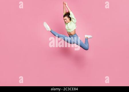 Full length body size view of her she nice-looking attractive lovely athletic perfect shape cheerful cherry girl jumping running moving contemporary Stock Photo