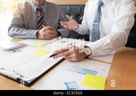 Team work process young business managers crew working with new startup project ,discussting and analyse graph plans Stock Photo