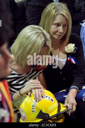 Mourners attend a funeral service for victims of a bus crash, in Santo