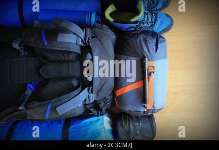 Flat lay composition with camping equipment on wooden background Stock Photo
