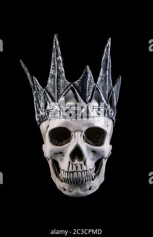 Human skull with crown isolated on black background Stock Photo