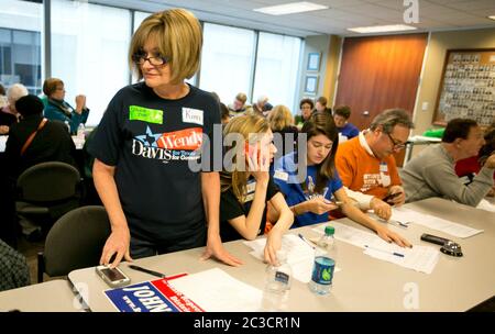 Austin Texas USA, November 23 2013: Volunteers for Battleground Texas and the state Democratic Party at a phone bank make calls to potential voters. Battleground Texas formed in 2013 and is attempting to 'turn Texas blue.' ©Marjorie Kamys Cotera/Daemmrich Photography Stock Photo