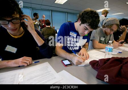 Austin Texas USA, November 23 2013: Volunteers for Battleground Texas and the state Democratic Party at a phone bank make calls to potential voters. Battleground Texas formed in 2013 and is attempting to 'turn Texas blue.' ©Marjorie Kamys Cotera/Daemmrich Photography Stock Photo