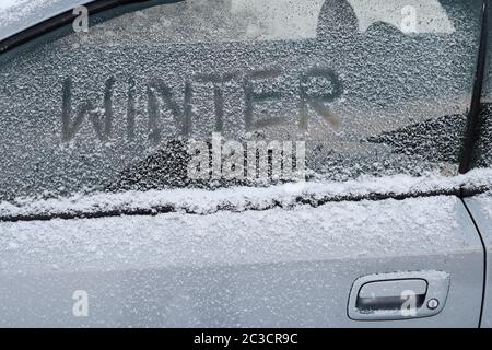 Winter in traffic. A car with snow and ice Stock Photo