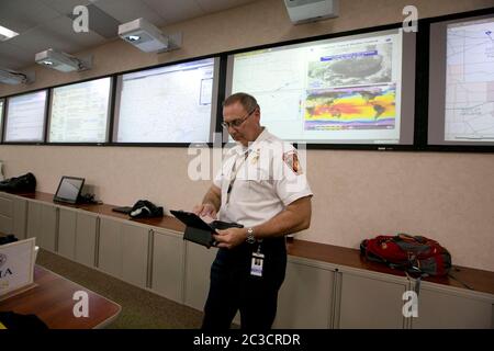 Austin, Texas USA, December 2013: Employees of the Texas Department of Public Safety and Texas Division of Emergency Management conduct an exercise to activate the full Emergency Management Council inside the newly renovated State Operations Center, which would be activated during emergencies and disasters.  ©Marjorie Kamys Cotera/Daemmrich Photography Stock Photo