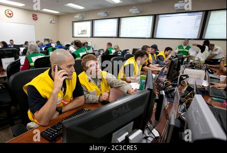 Austin, Texas USA, December 2013: Employees of the Texas Department of Public Safety and Texas Division of Emergency Management conduct an exercise to activate the full Emergency Management Council inside the newly renovated State Operations Center, which would be activated during emergencies and disasters.  ©Marjorie Kamys Cotera/Daemmrich Photography Stock Photo