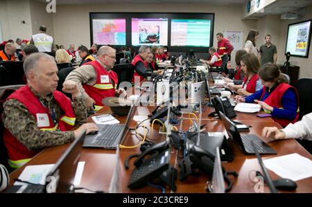 Austin, Texas USA, December 2013: Employees of the Texas Department of Public Safety and Texas Division of Emergency Management conduct an exercise to activate the full Emergency Management Council inside the newly renovated State Operations Center, which would be activated during emergencies and disasters.  ©Marjorie Kamys Cotera/Daemmrich Photography Stock Photo