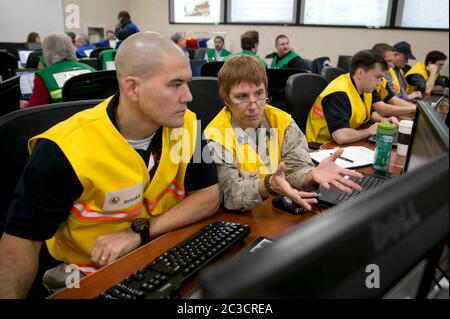 Austin, Texas USA, December 2013: Employees of the Texas Department of Public Safety and Texas Division of Emergency Management conduct an exercise to activate the full Emergency Management Council inside the newly renovated State Operations Center, which would be activated during emergencies and disasters.  ©Marjorie Kamys Cotera/Daemmrich Photography Stock Photo