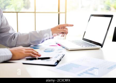 Team work process. young business managers crew working with new startup project. tablet on wood table, typing keyboard, texting message, analyse grap Stock Photo