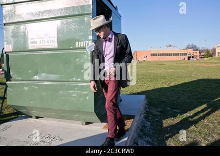 Austin Texas USA, February 12, 2014: Huston Tillotson University environmental science professor Dr. Jeff Wilson plans to male a 330 square-foot dumpster his home for a full year. By living in the dumpster, he will experiment with innovative ways to live with less and practice low-waste living principles.   ©Marjorie Kamys Cotera/Daemmrich Photography Stock Photo